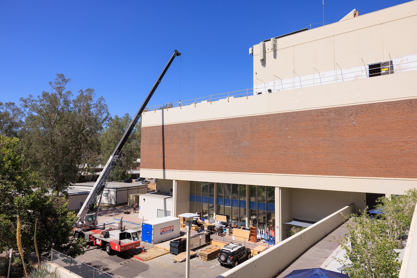 a construction crane rising above a building