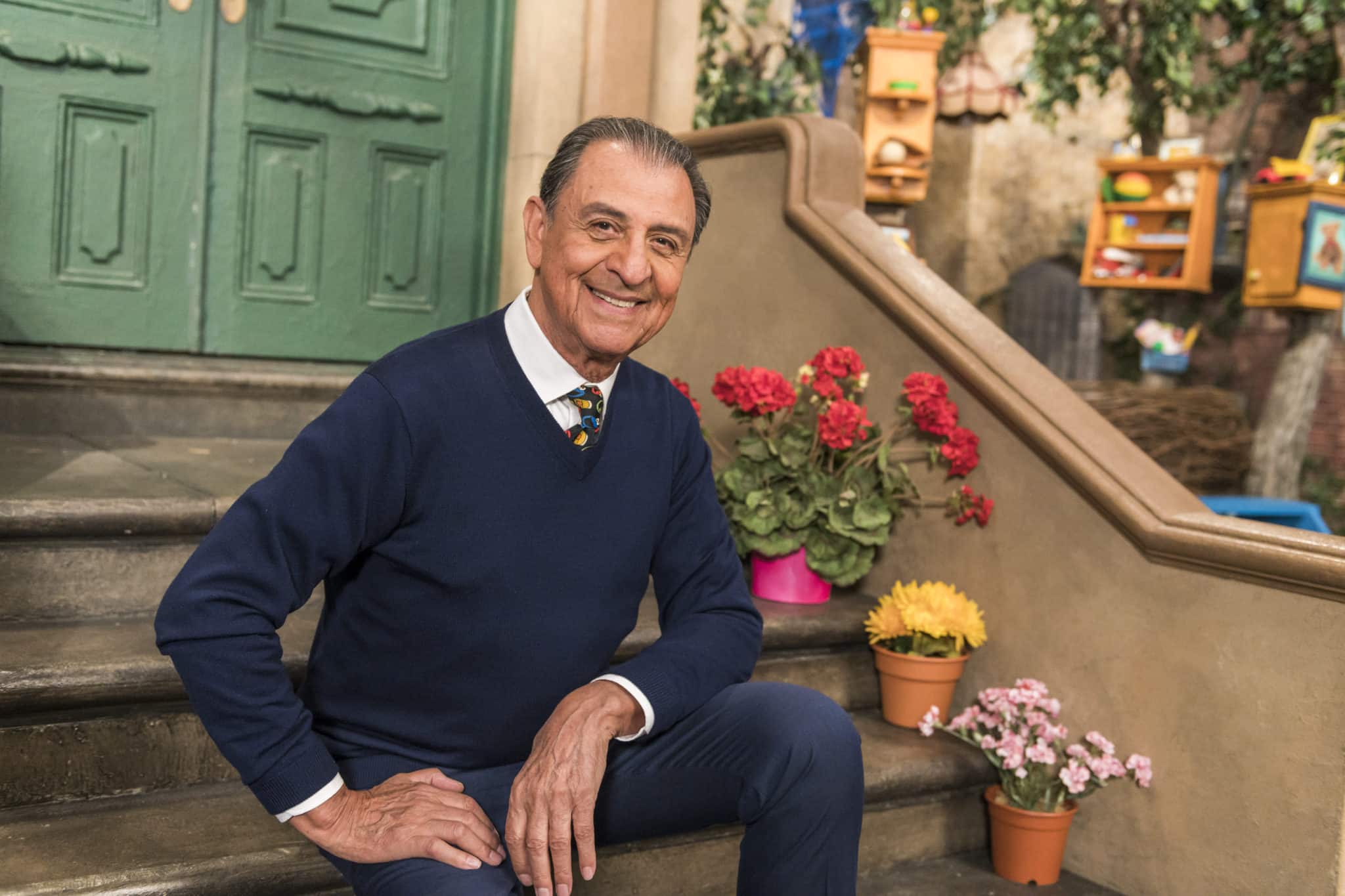 smiling man sitting on steps