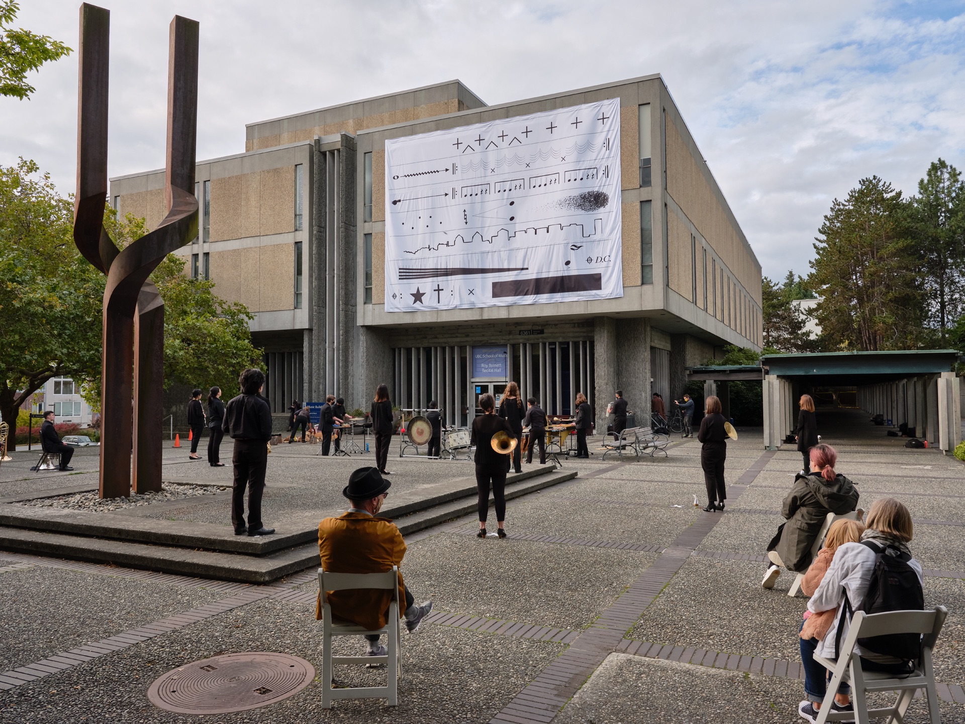 The UBC School of Music Symphonic Wind Ensemble, led by Robert Taylor, performs Raven Chacon's work, American Ledger (No. 1), 2018, outside the Music Building at the University of British Columbia, October 8, 2020, as part of Soundings: An Exhibition in Five Parts at the Morris and Helen Belkin Art Gallery (September 8-December 6, 2020). Photo: Rachel Topham Photography