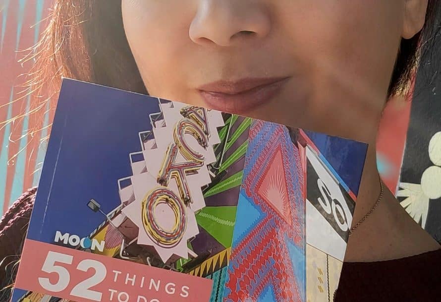 Teena Apples holding cover for her book '52 Things to Do in Los Angeles'