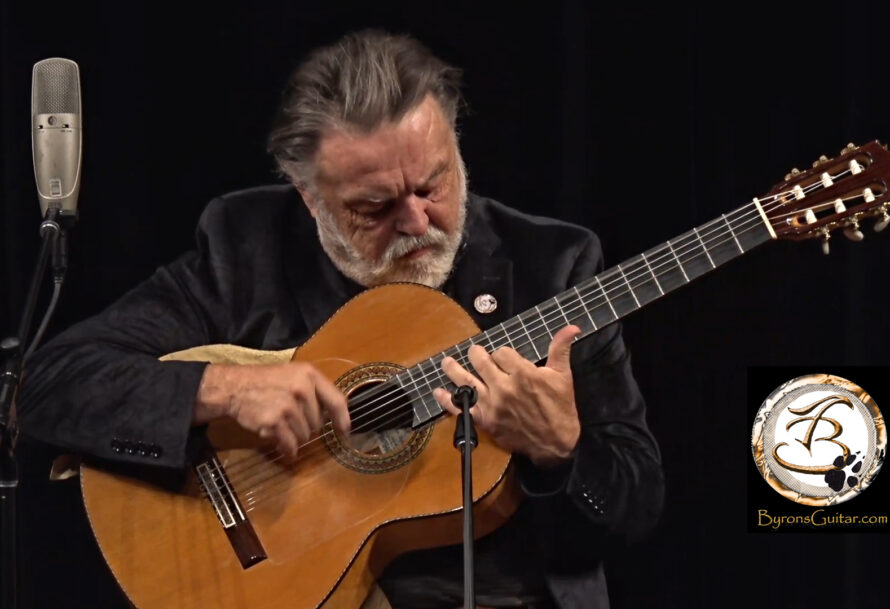 Byron Tomingas plays guitar